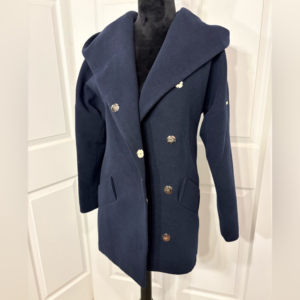 Volange brand size 10 woman’s double breasted navy blue coat.